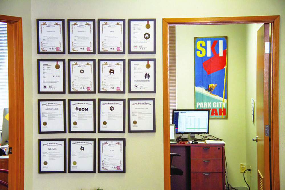 Office with numerous patent certificates and certificates
