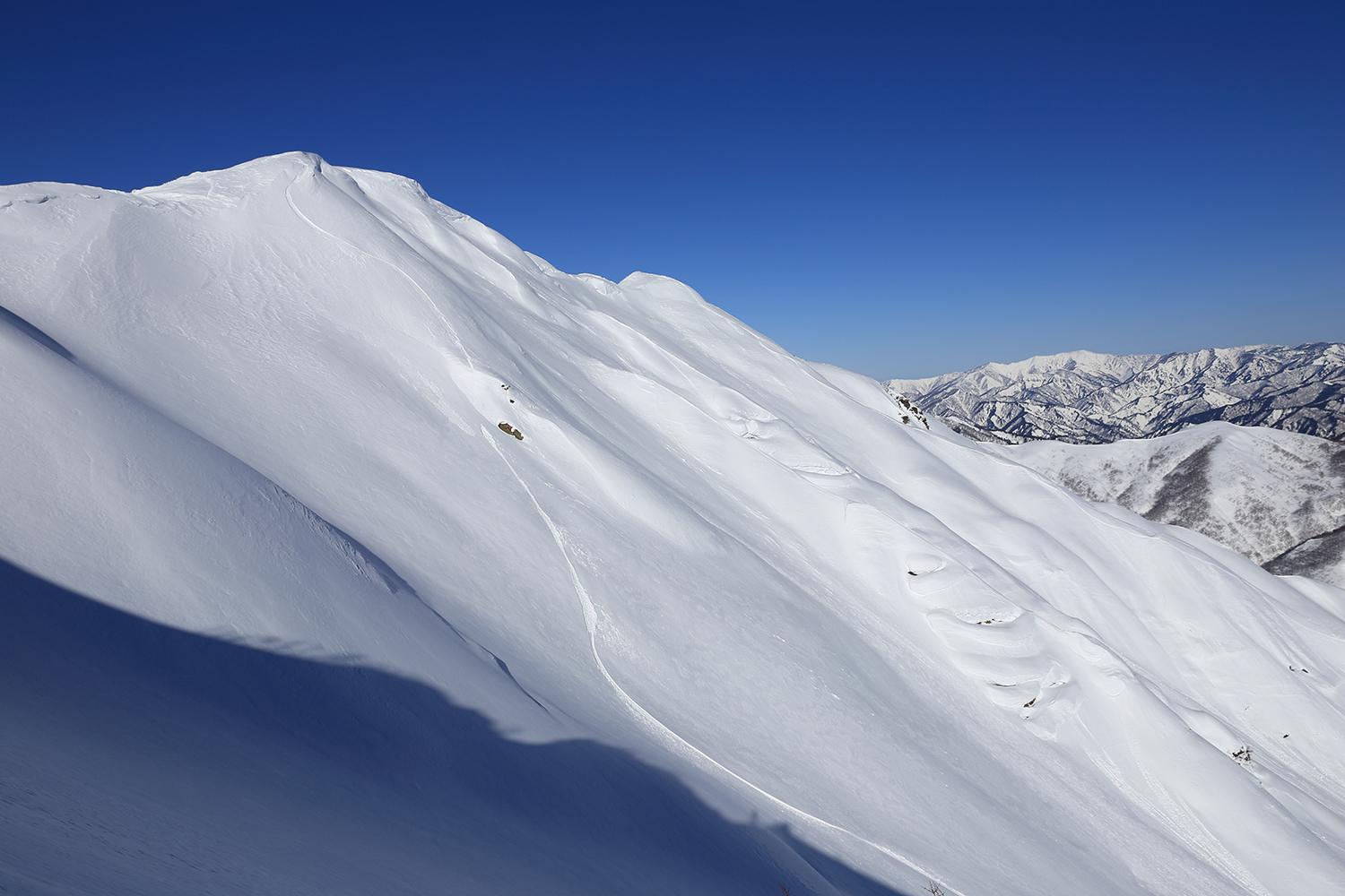 Cliff and line where Ryosuke Abe started to jump from Asahidake peak and jumped first